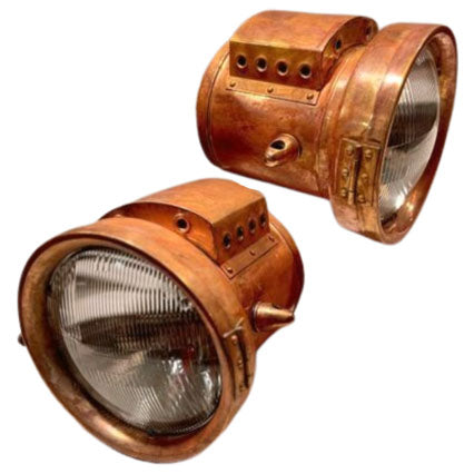 brass headlights with a patina finish